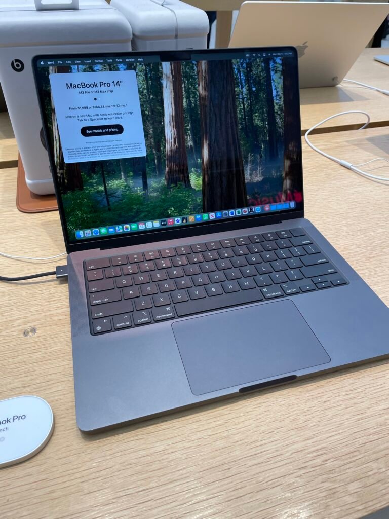 The MacBook Pro M3 Pro is seen sitting inside of an Apple Store and is a great laptop for Roblox game development